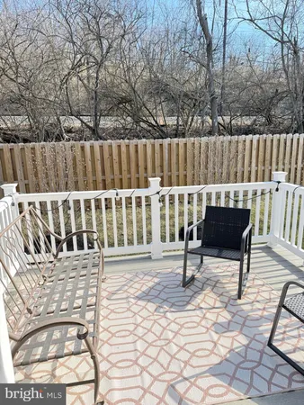 a view of a chairs with wooden floor