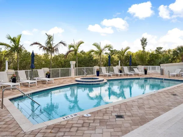 a view of a swimming pool with a lounge chair