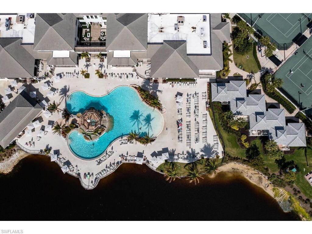 295 Grande Way, Unit 401 Naples, FL 34110 - Photo 18 of 19 an aerial view of residential houses with outdoor space