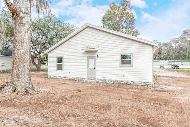 a view of a backyard of the house