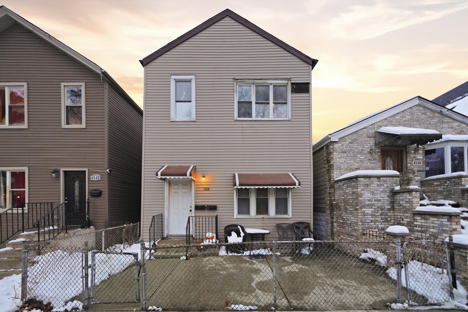 a brick house with a large windows