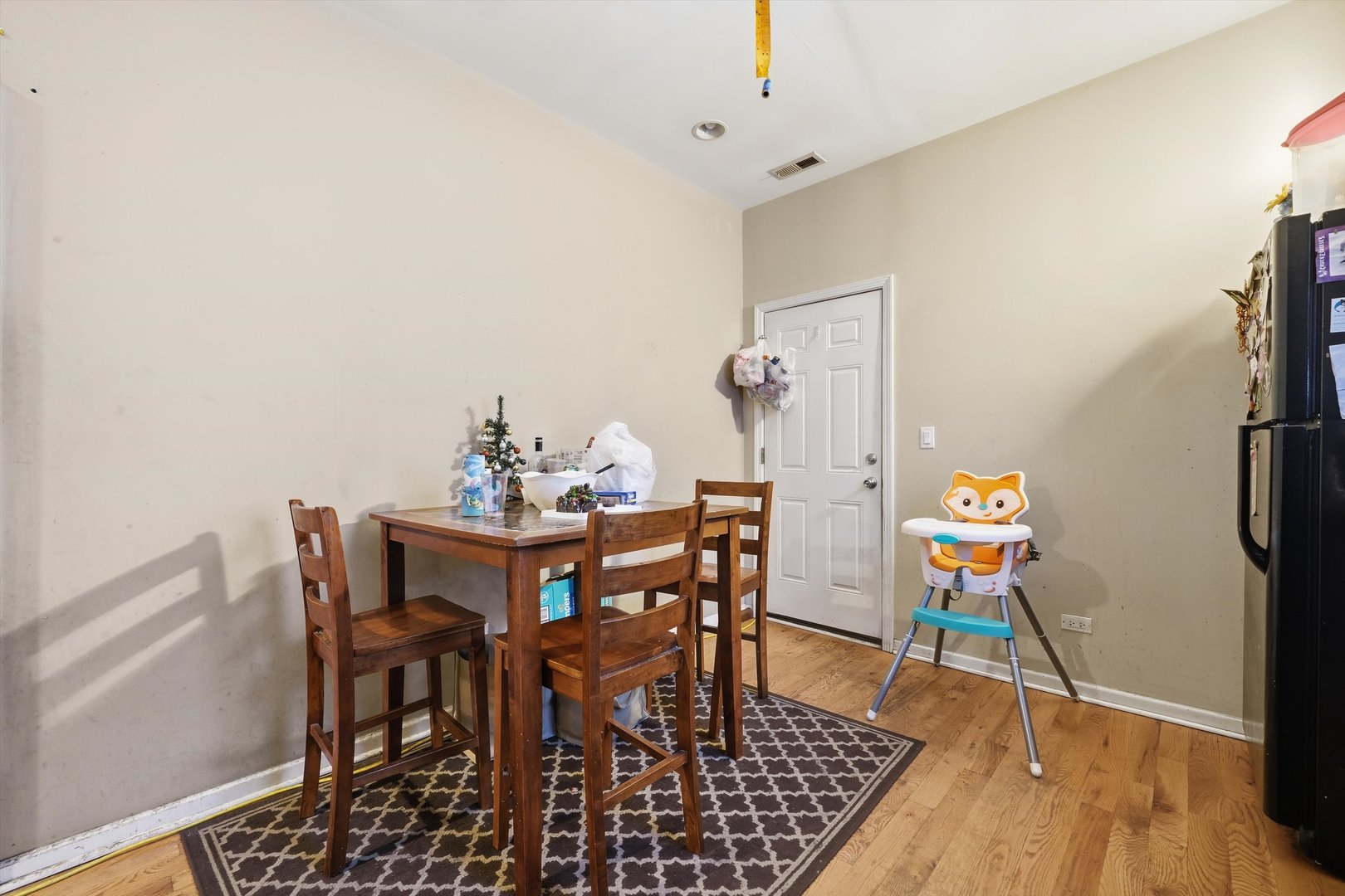 4547 South Union Avenue Chicago, IL 60609 - Photo 13 of 25 a view of a dining room with furniture and wooden floor