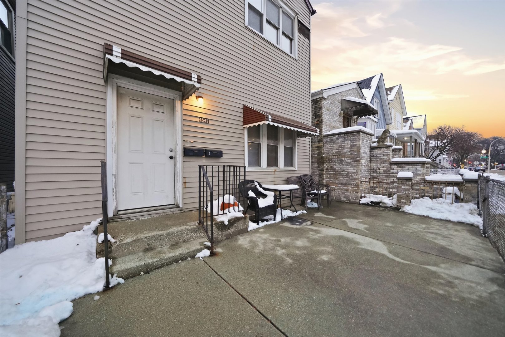 4547 South Union Avenue Chicago, IL 60609 - Photo 4 of 25 a view of a house with a patio and wooden fence