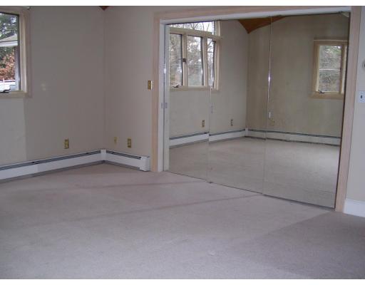 5 Valley Road Dracut, MA 01826 - Photo 3 of 8 an empty room with windows