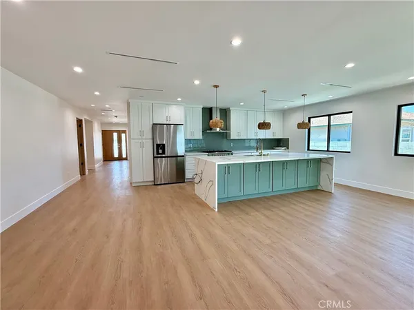 a view of kitchen with wooden floor and window