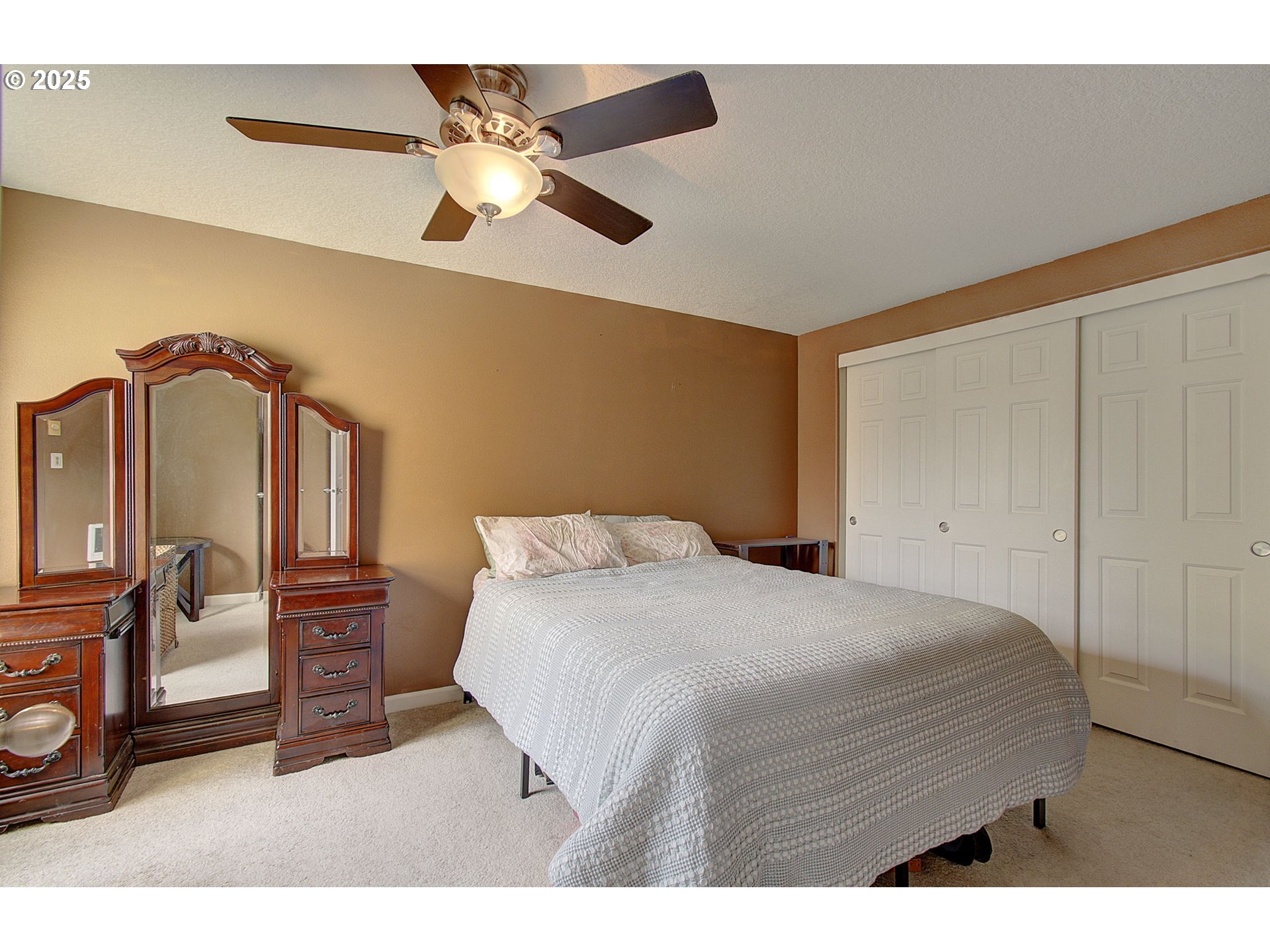 275 Southeast 162nd Avenue Portland, OR 97233 - Photo 15 of 22 a bedroom with a bed and a chandelier