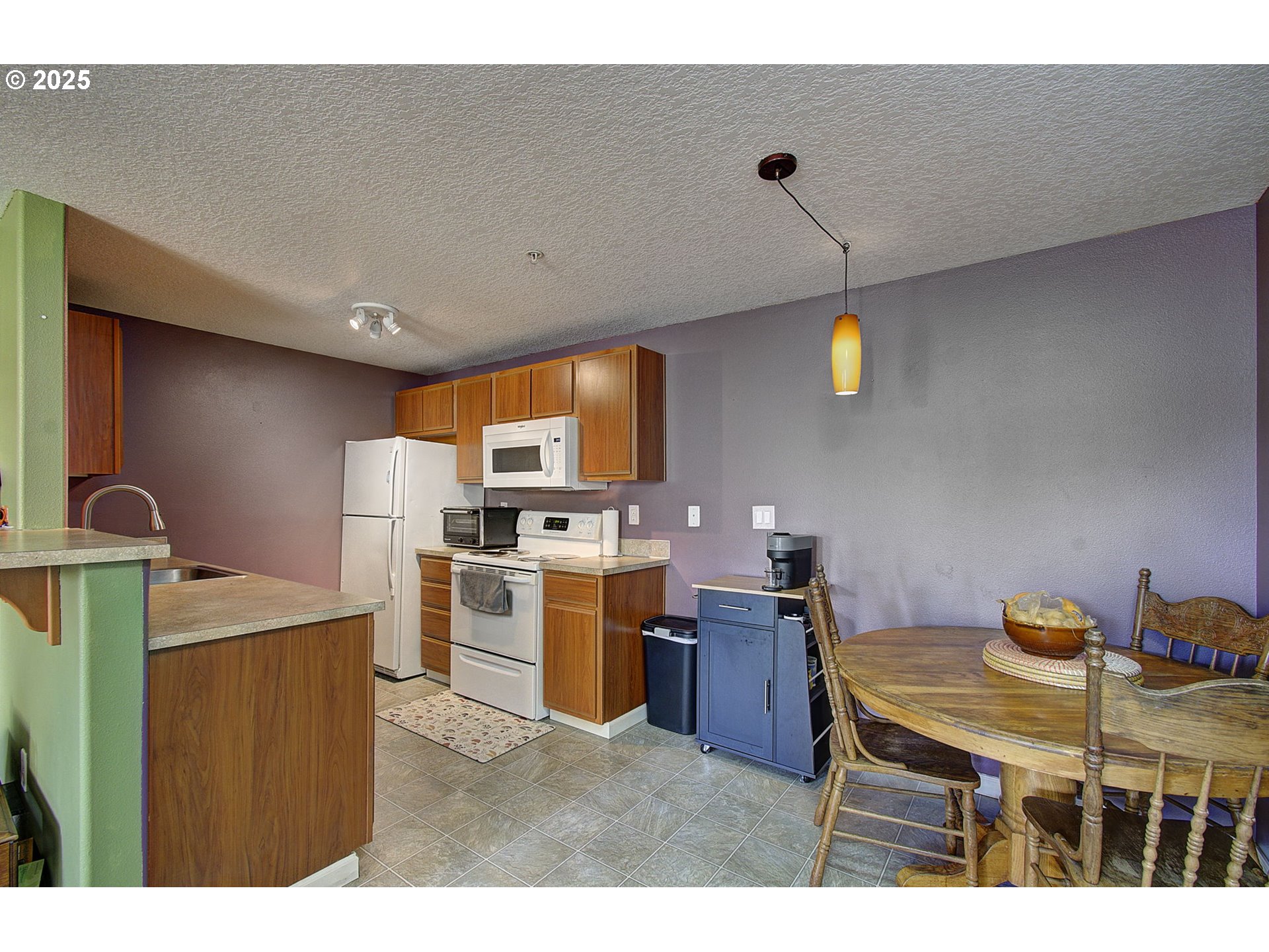 275 Southeast 162nd Avenue Portland, OR 97233 - Photo 6 of 22 a kitchen with a sink cabinets and window