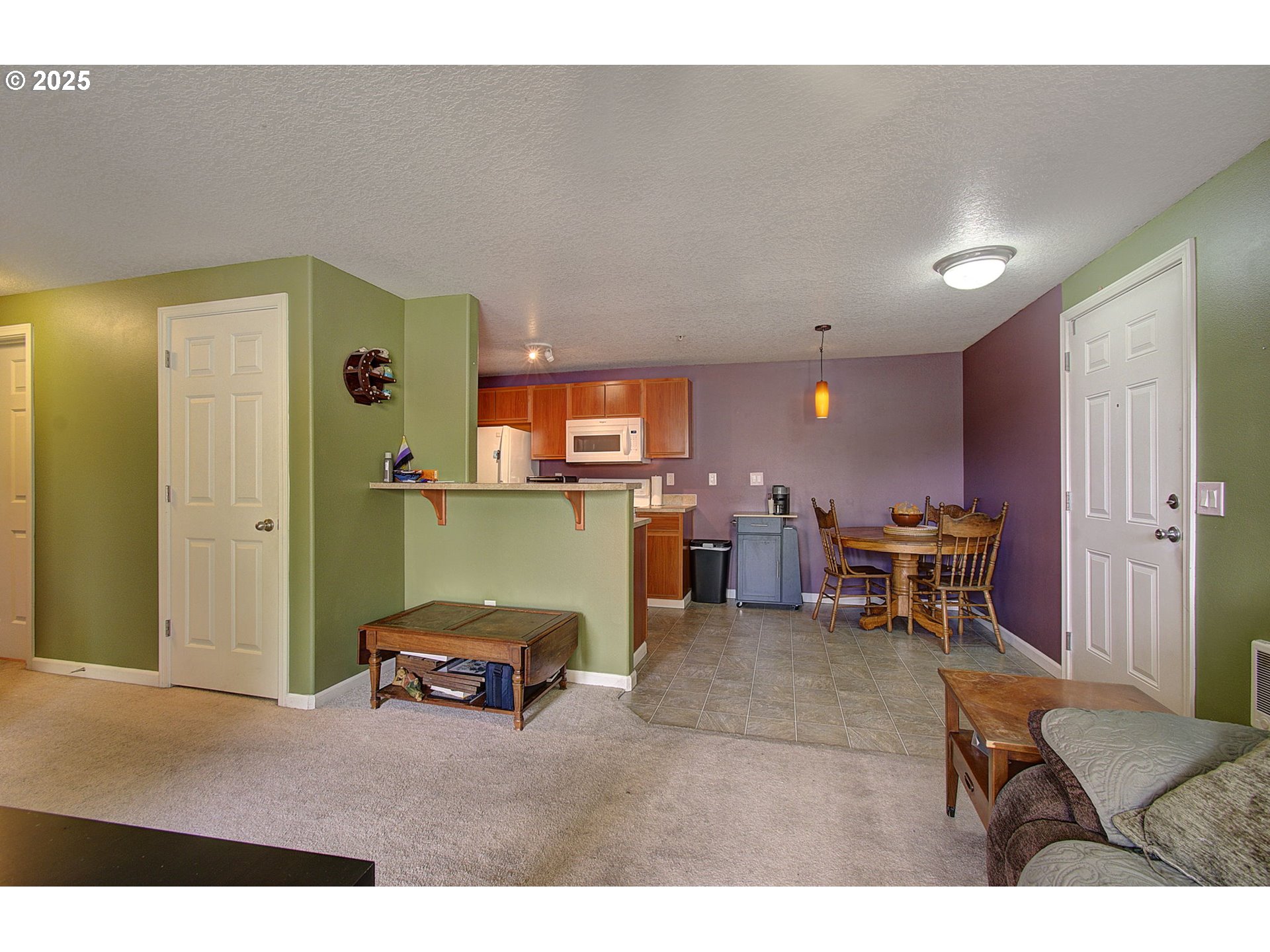 275 Southeast 162nd Avenue Portland, OR 97233 - Photo 7 of 22 a living room with furniture and a table