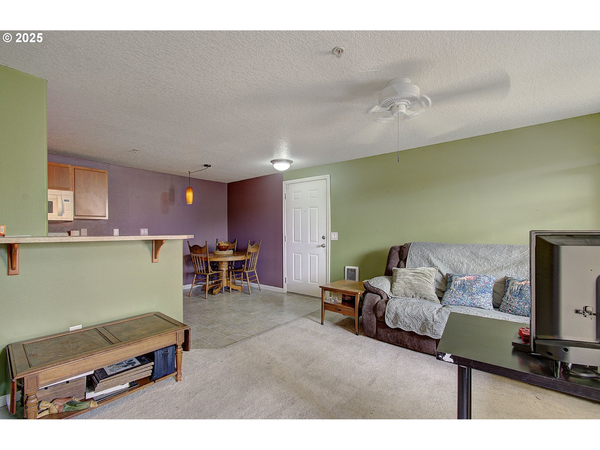 275 Southeast 162nd Avenue Portland, OR 97233 - Photo 9 of 22 a living room with furniture and a flat screen tv