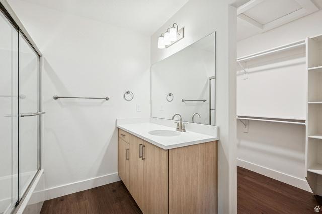 1627 North Angel Street Layton, UT 84041 - Photo 13 of 39 Full bath with vanity, dark wood-type flooring, a spacious closet, and enclosed tub / shower combo