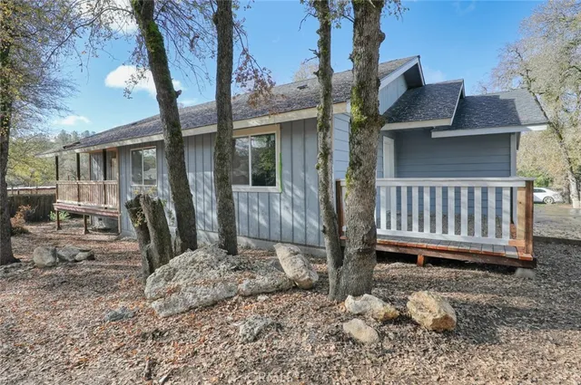 a kitchen with stainless steel appliances granite countertop a stove top oven a sink and a refrigerator