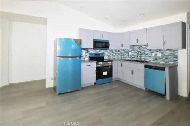 a view of an empty room with closet area