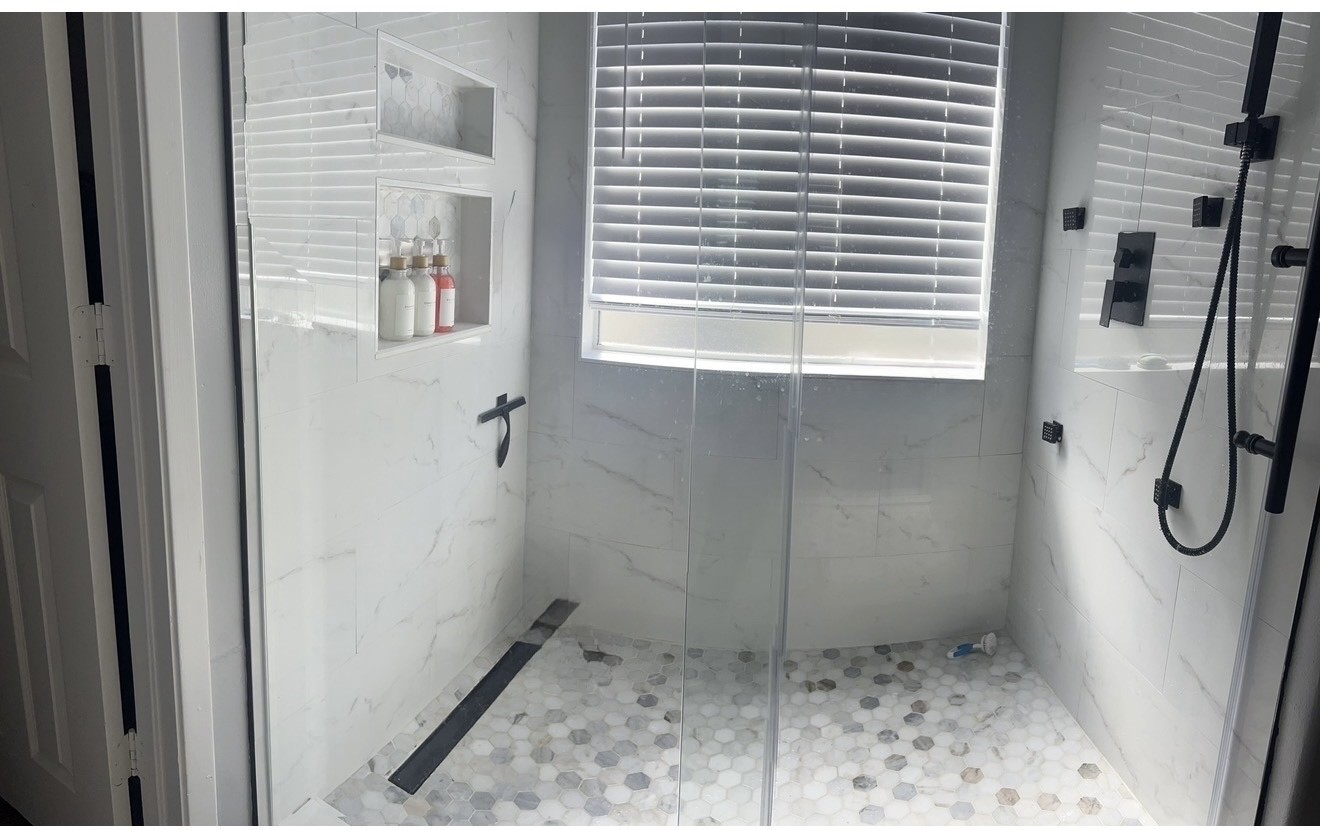 19331 Grand Colony Court Katy, TX 77449 - Photo 11 of 14 a bathroom with a glass door shower