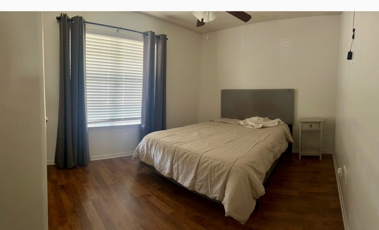 19331 Grand Colony Court Katy, TX 77449 - Photo 10 of 14 a bed sitting in a bedroom next to a window