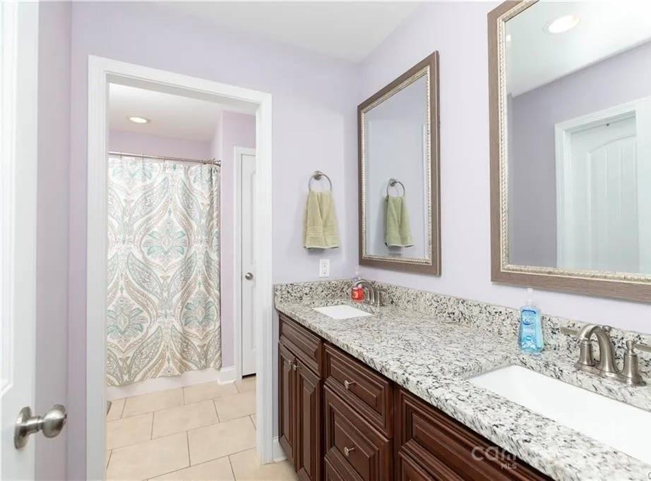 2944 Ranger Road Clover, SC 29710 - Photo 17 of 23 a bathroom with a granite countertop sink and a mirror