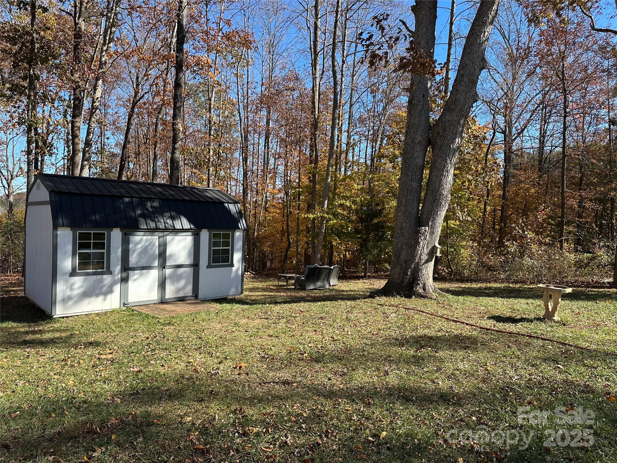 2944 Ranger Road Clover, SC 29710 - Photo 20 of 23 a view of a house with a large tree and a yard