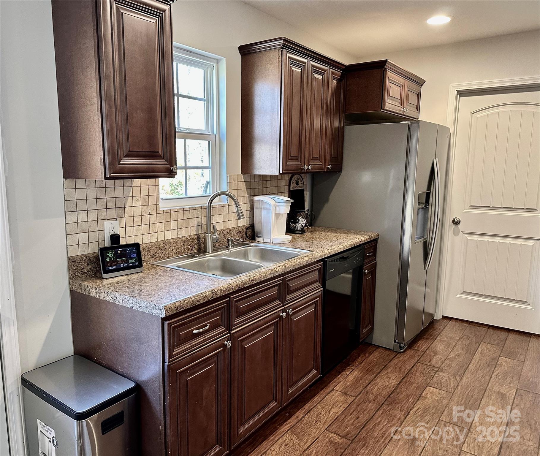 2944 Ranger Road Clover, SC 29710 - Photo 6 of 23 a kitchen with stainless steel appliances granite countertop a sink stove refrigerator and cabinets