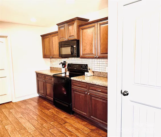 a kitchen with a sink and a microwave