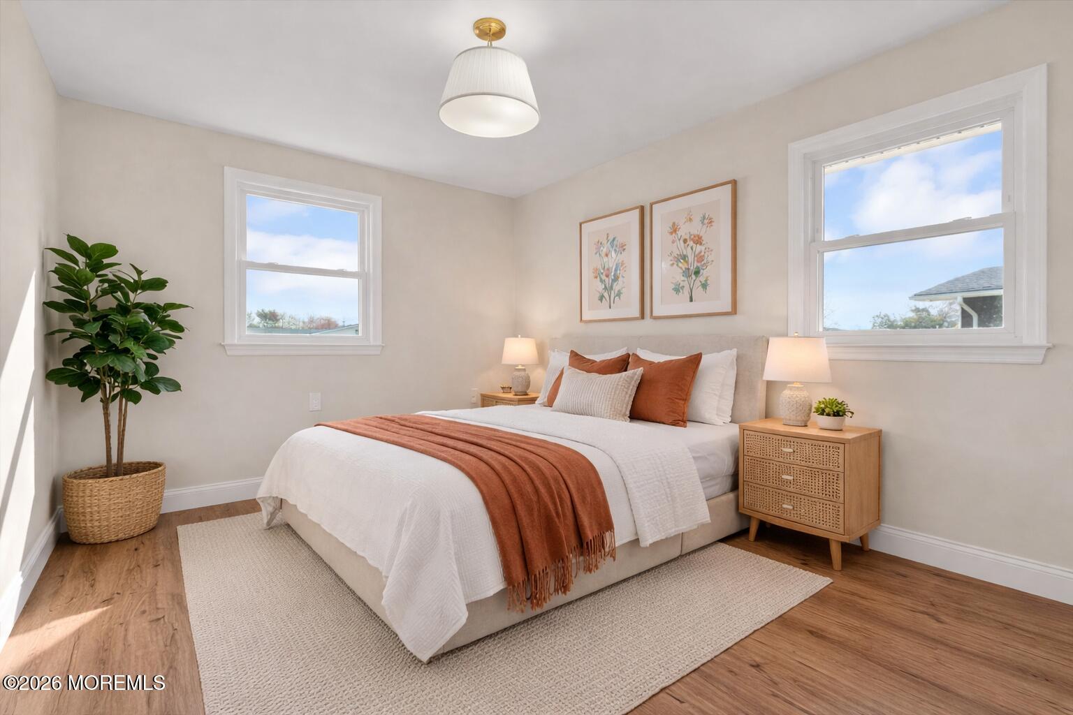 69 Clay Circle Brick, NJ 08724 - Photo 19 of 27 a bedroom with a bed and a potted plant