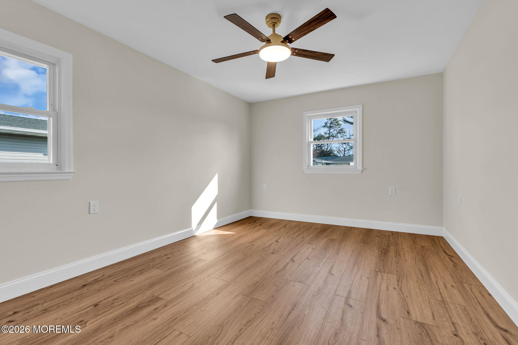 69 Clay Circle Brick, NJ 08724 - Photo 22 of 27 a view of an empty room with wooden floor and a window