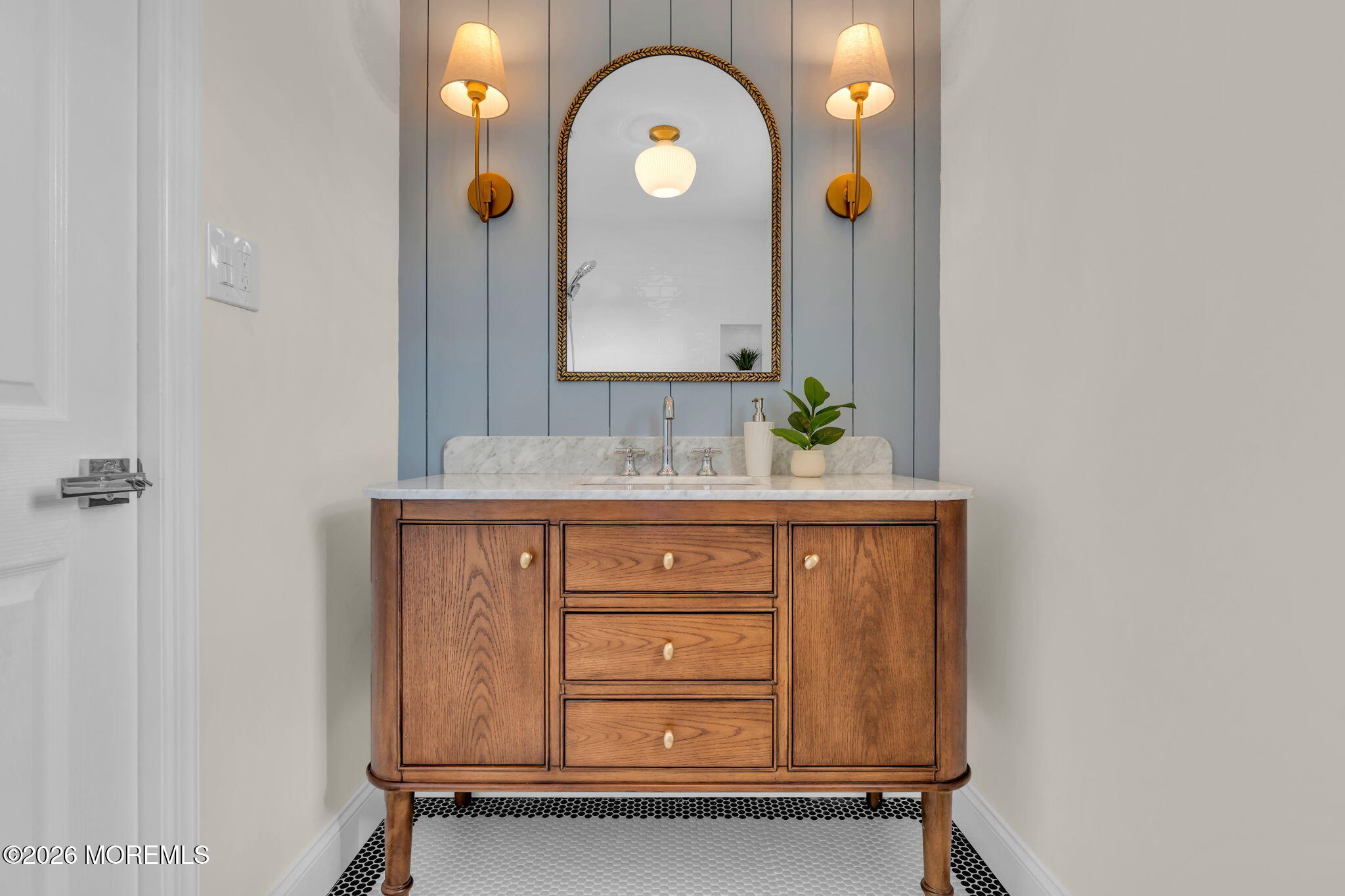 69 Clay Circle Brick, NJ 08724 - Photo 23 of 27 a bathroom with a mirror and a sink