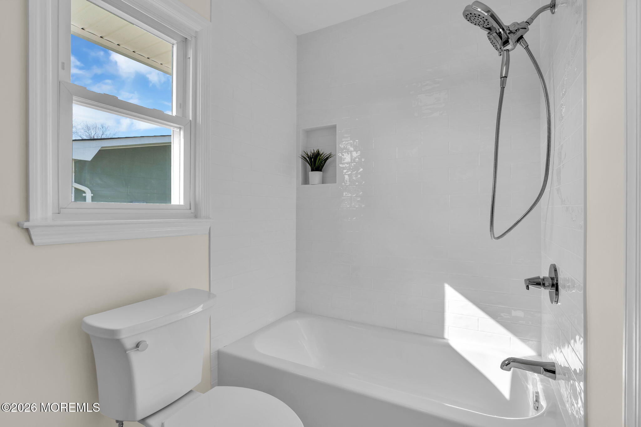 69 Clay Circle Brick, NJ 08724 - Photo 24 of 27 a bathroom with a toilet and a bathtub