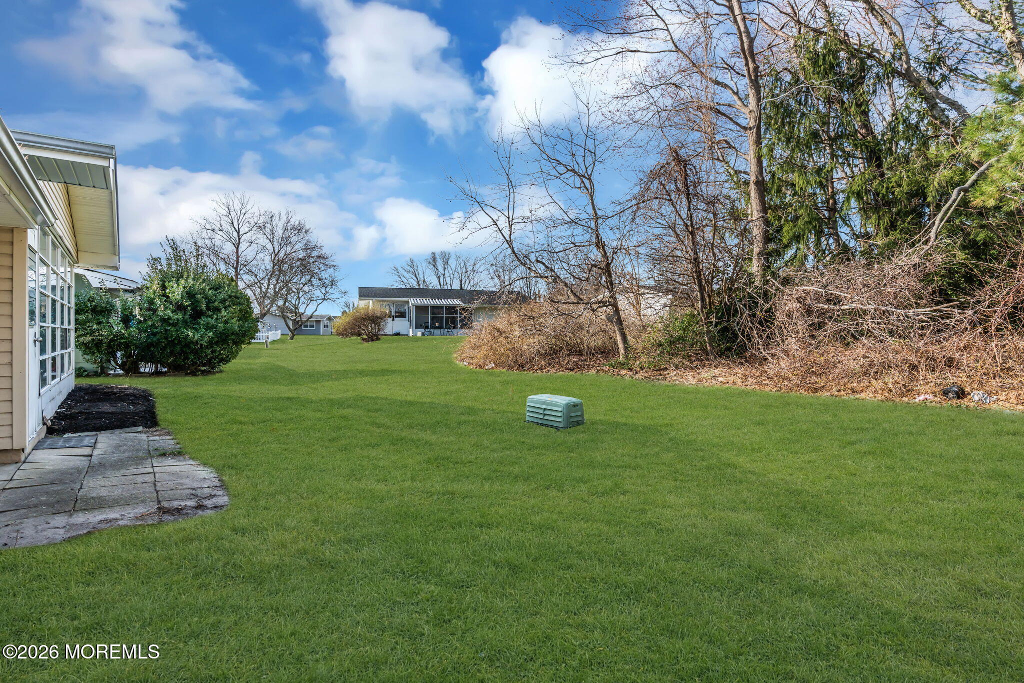 69 Clay Circle Brick, NJ 08724 - Photo 26 of 27 a view of a garden with a tree