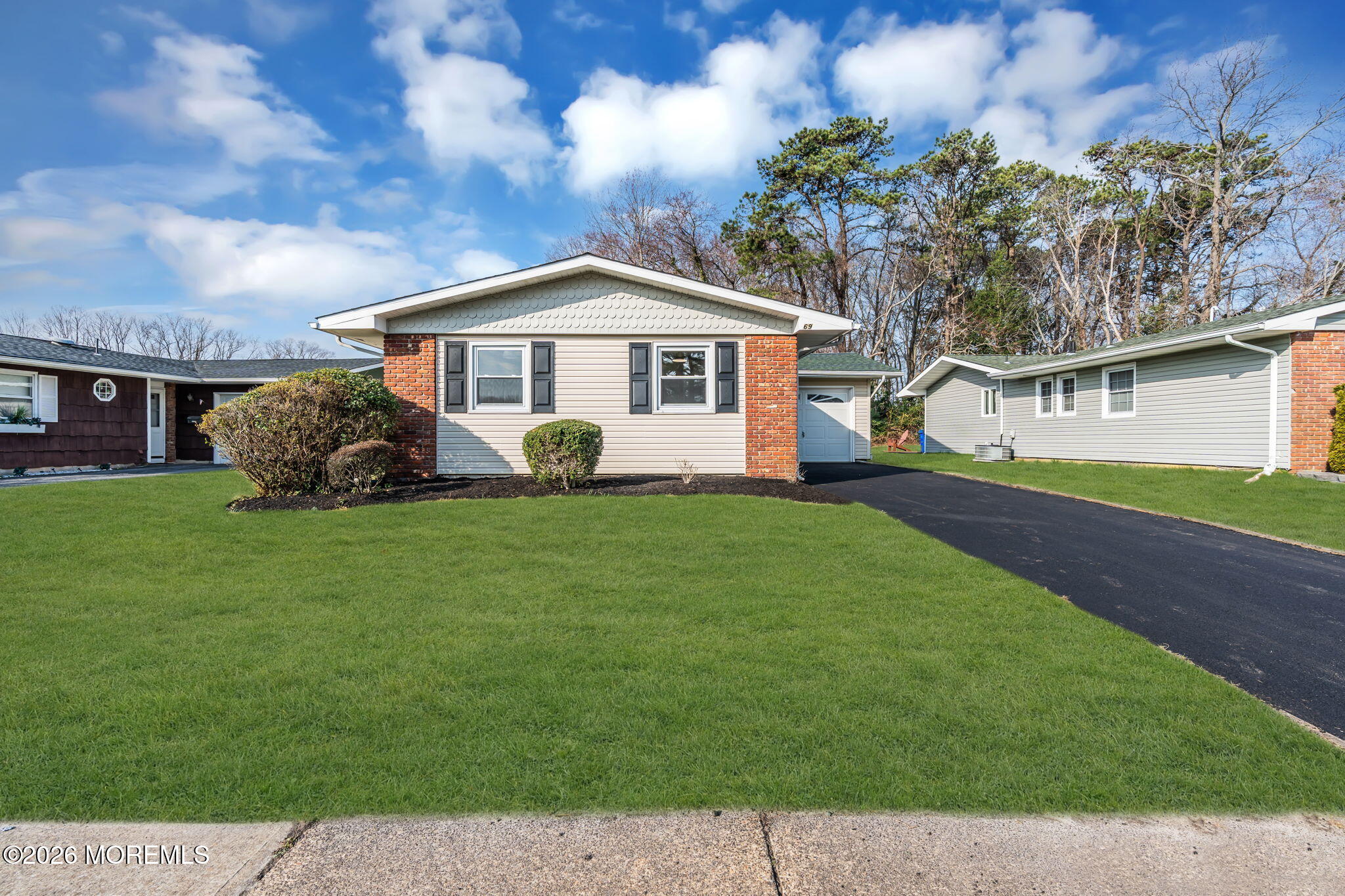 69 Clay Circle Brick, NJ 08724 - Photo 3 of 27 a front view of a house with garden