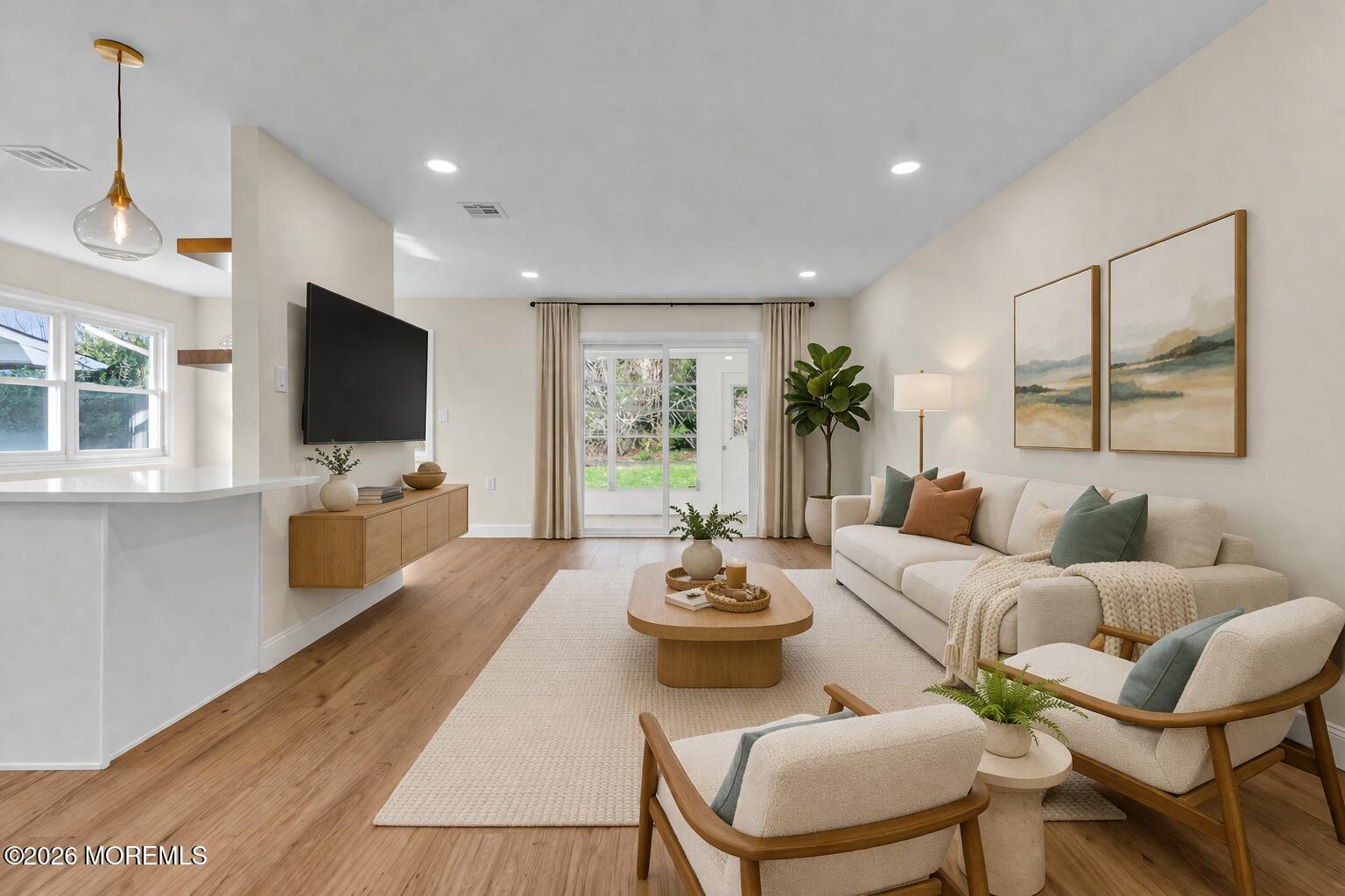 69 Clay Circle Brick, NJ 08724 - Photo 5 of 27 a living room with furniture flat screen tv and a large window