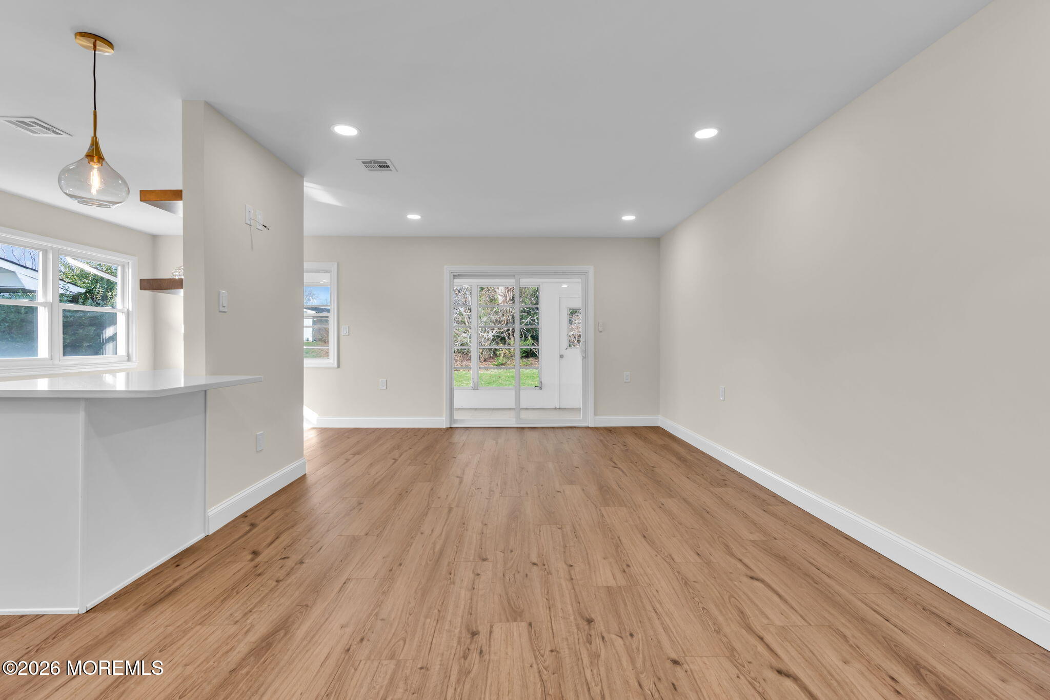 69 Clay Circle Brick, NJ 08724 - Photo 6 of 27 a view of an empty room with wooden floor and a window