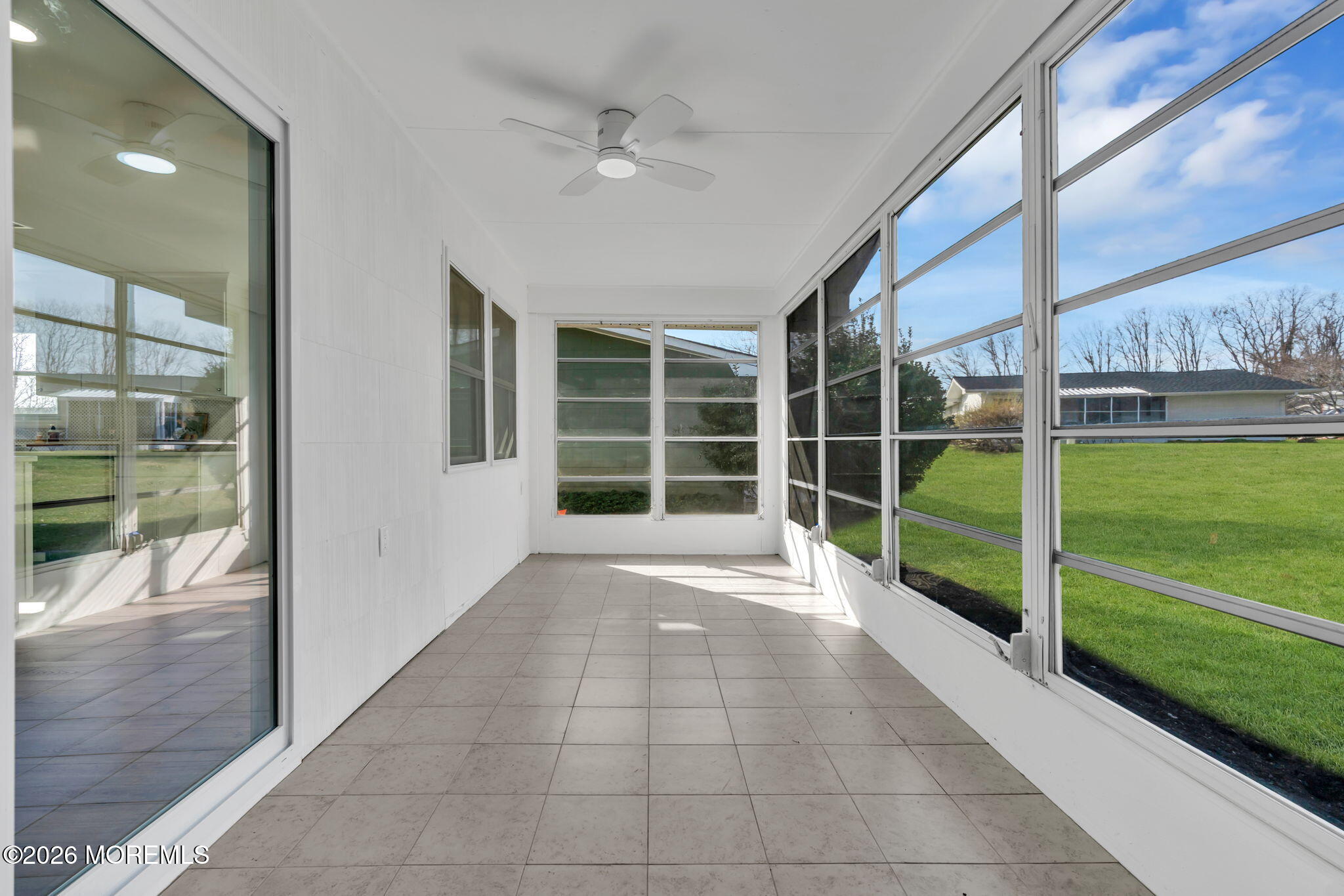 69 Clay Circle Brick, NJ 08724 - Photo 9 of 27 a view of a porch with a floor to ceiling window and garden