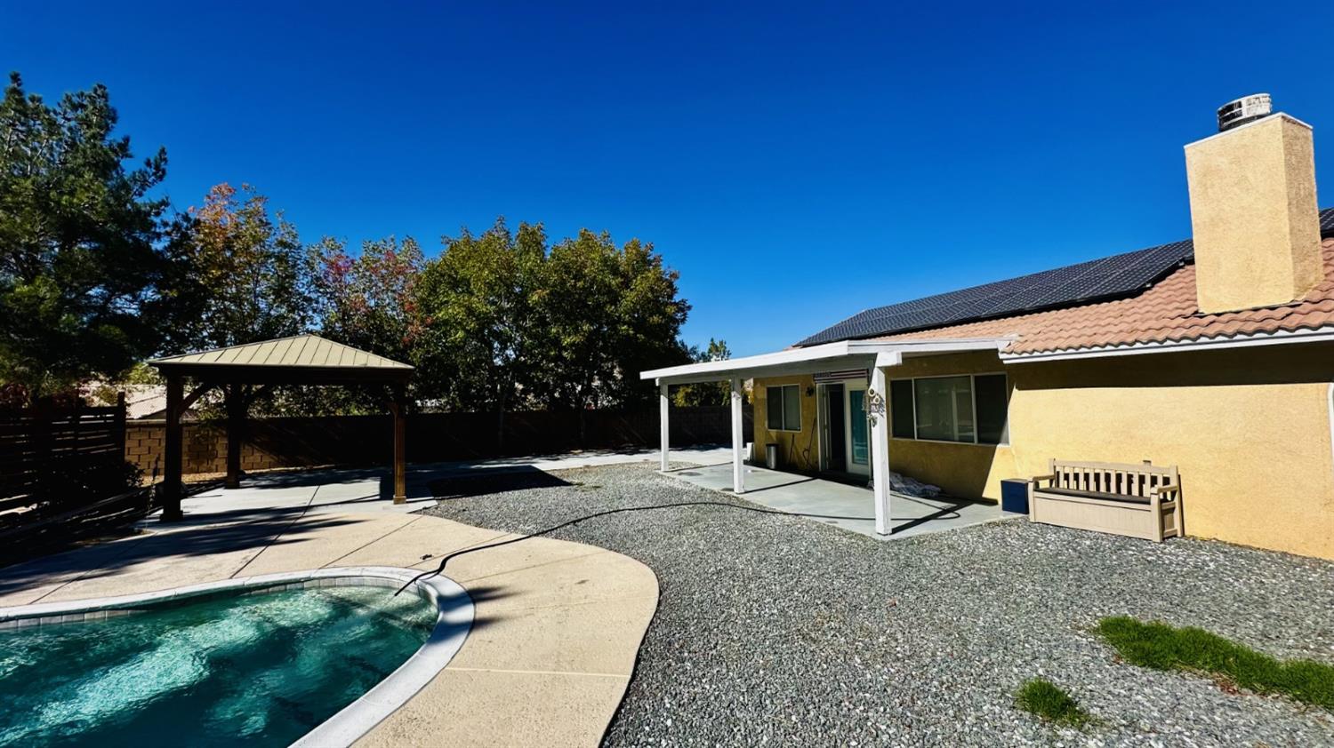 15358 Lookout Road Apple Valley, CA 92307 - Photo 26 of 30 a view of a house with a patio