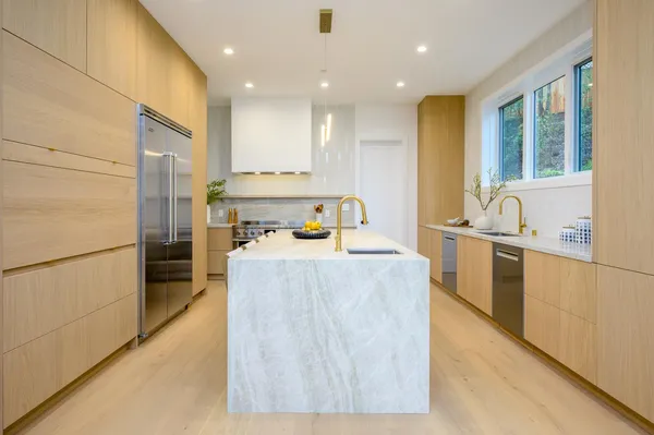 a kitchen with a sink a stove and a refrigerator