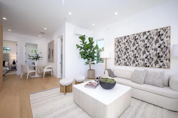 a kitchen with stainless steel appliances granite countertop a stove a refrigerator and a microwave