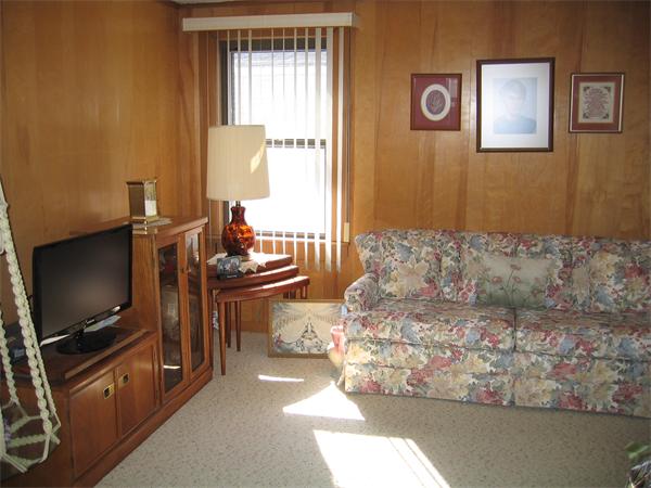 26 Wintworth Street Chicopee, MA 01013 - Photo 11 of 13 a living room with furniture and a flat screen tv