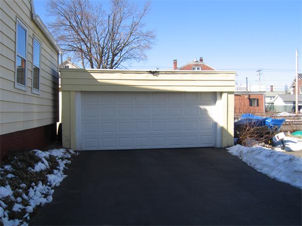 26 Wintworth Street Chicopee, MA 01013 - Photo 2 of 13 a view of a house with a street