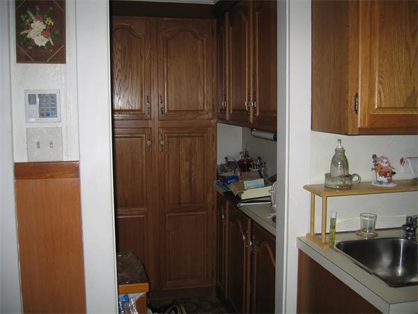 26 Wintworth Street Chicopee, MA 01013 - Photo 3 of 13 a kitchen with a refrigerator and cabinets