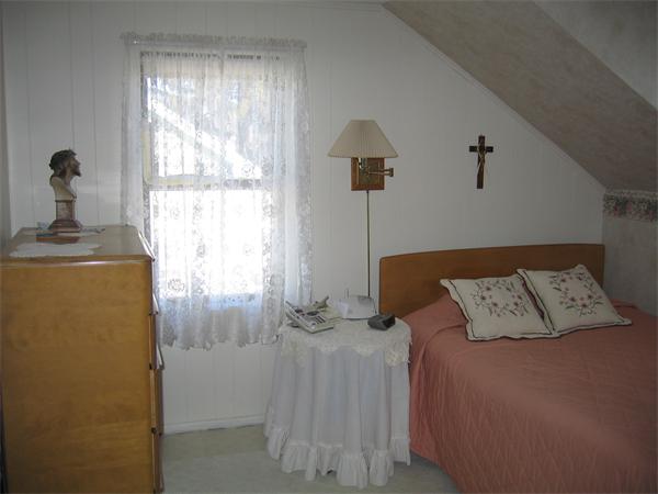 26 Wintworth Street Chicopee, MA 01013 - Photo 8 of 13 a bed sitting in a bedroom next to a window