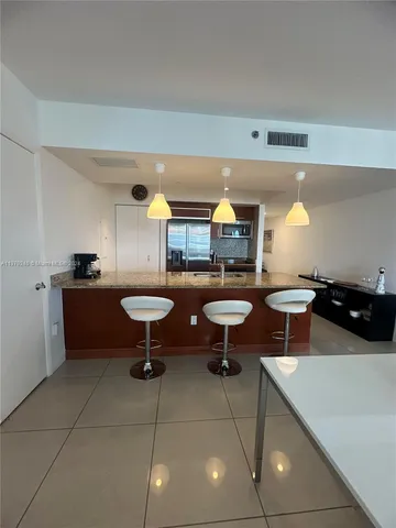 a living room with furniture a window and a table