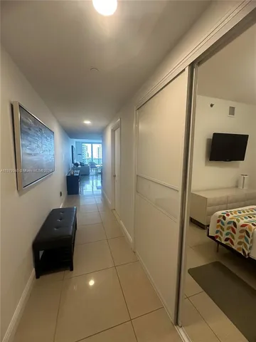 a living room with a couch and a view of living room