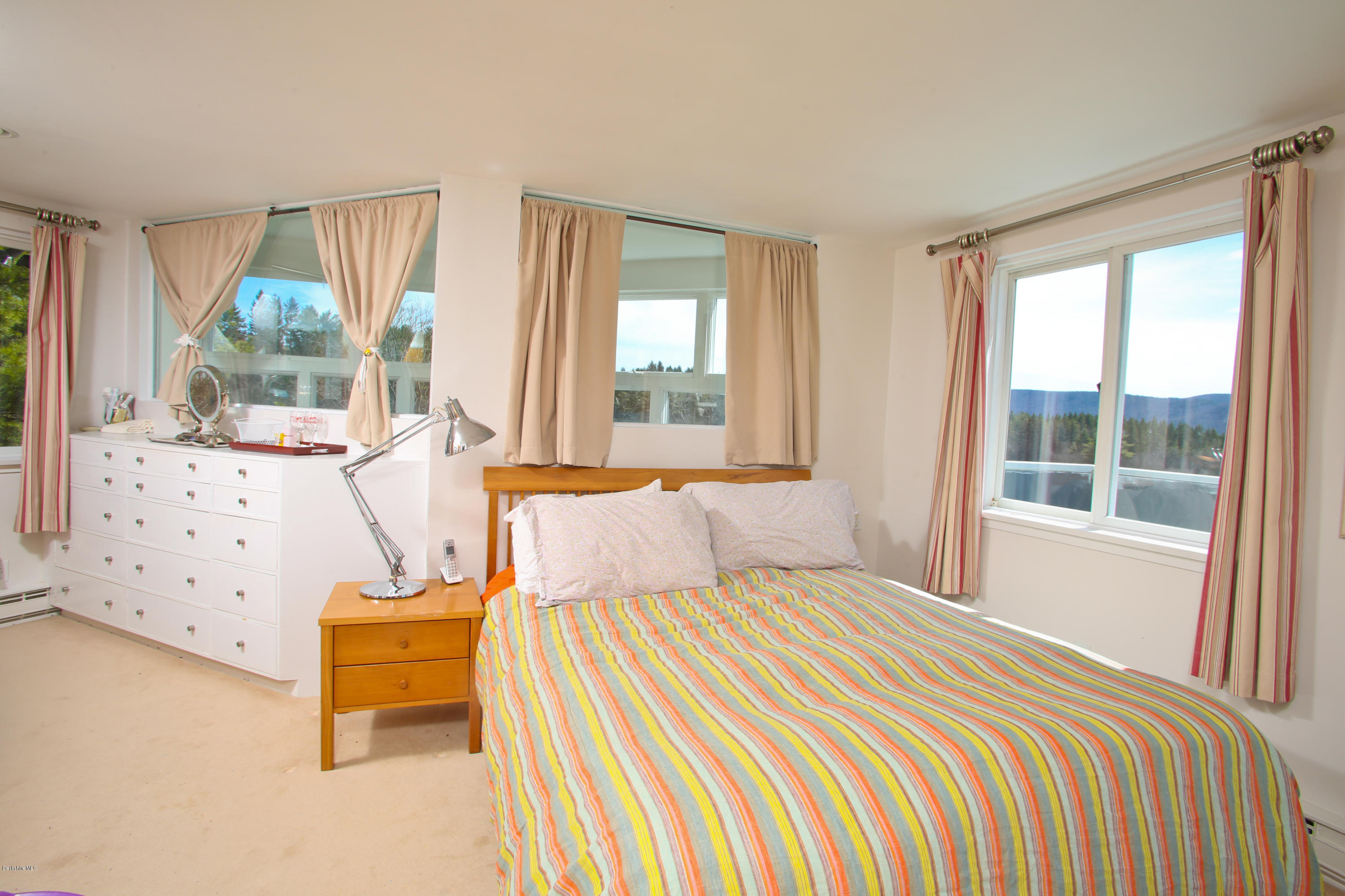 29 Rattlesnake Mountain Road Stockbridge, MA 01262 - Photo 10 of 21 a bedroom with a bed and a window