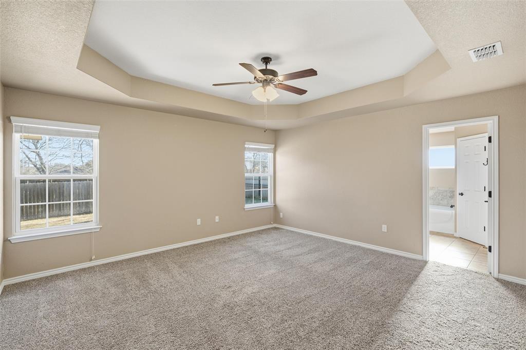 37 Buckskin Loop Belton, TX 76513 - Photo 13 of 25 an empty room with windows and fan