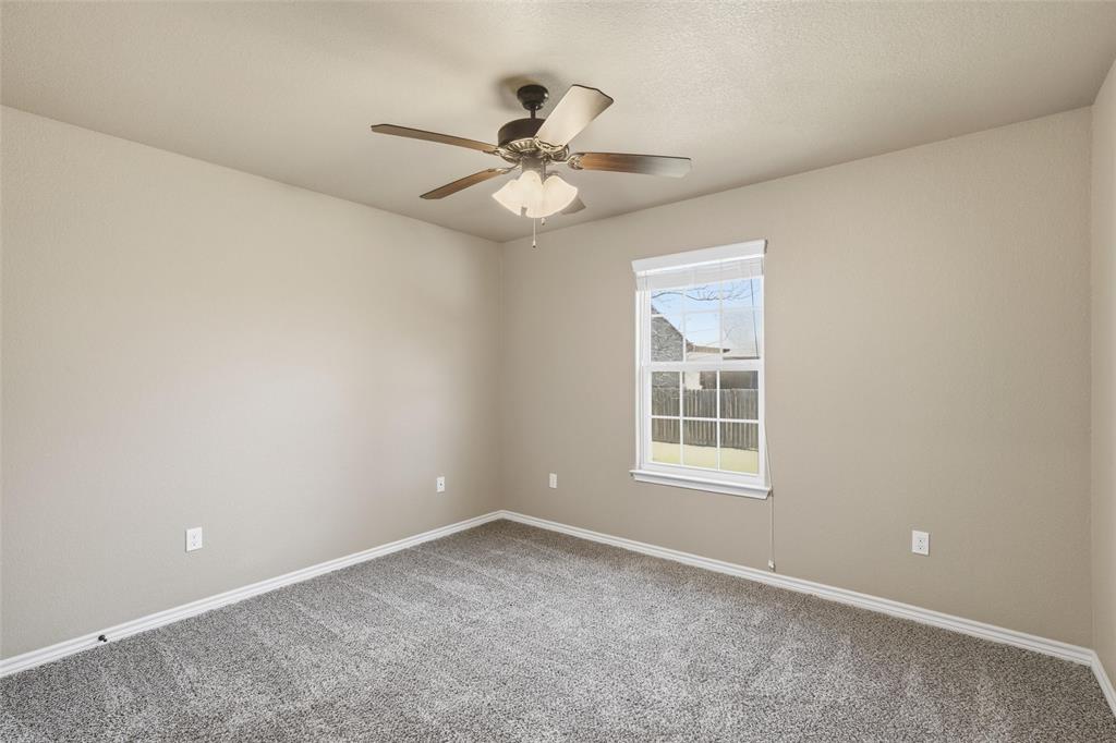 37 Buckskin Loop Belton, TX 76513 - Photo 18 of 25 an empty room with a window and a fan