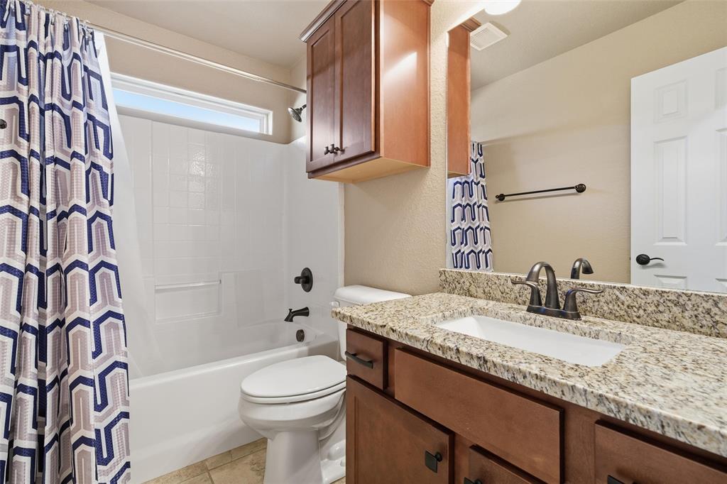37 Buckskin Loop Belton, TX 76513 - Photo 20 of 25 a bathroom with a granite countertop sink toilet and shower