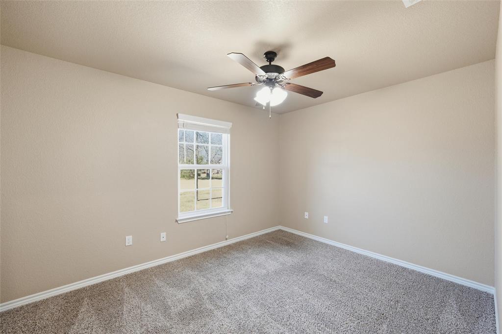 37 Buckskin Loop Belton, TX 76513 - Photo 21 of 25 an empty room with a window and a fan