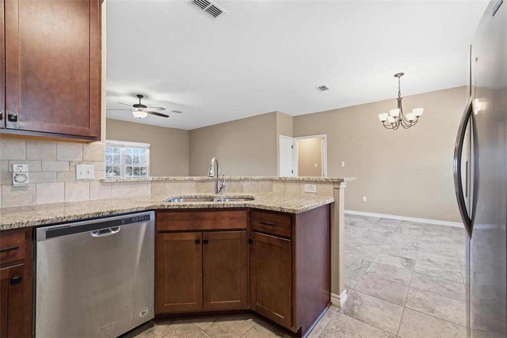 37 Buckskin Loop Belton, TX 76513 - Photo 10 of 25 a kitchen with a sink a counter space and cabinets
