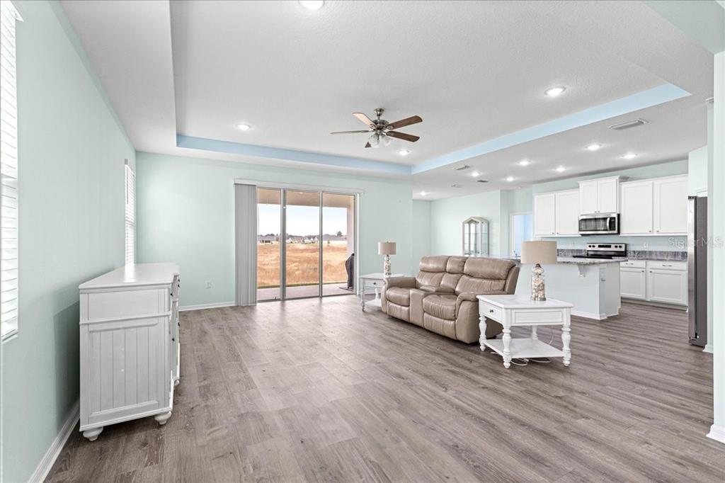 5851 Southwest 85th Place Ocala, FL 34476 - Photo 17 of 57 a living room with furniture and kitchen view