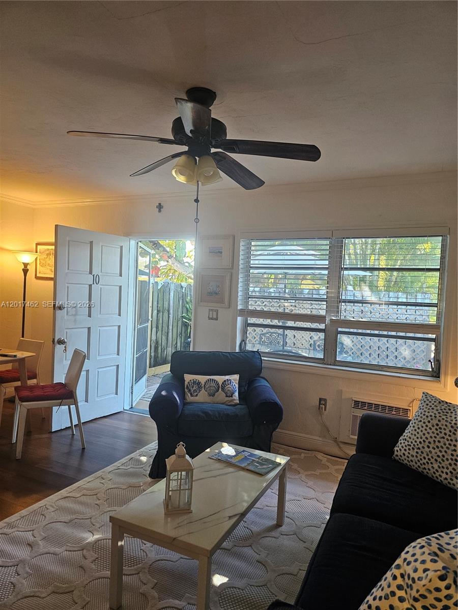 325 Fernwood Road, Unit 10 Key Biscayne, FL 33149 - Photo 7 of 12 a living room with furniture and a large window