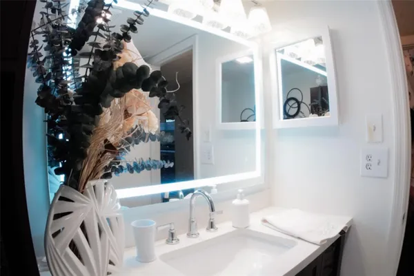 a bathroom with a sink and a mirror