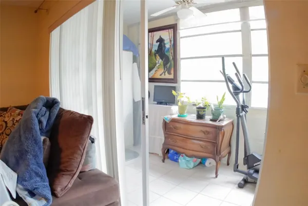 a living room with a flat screen tv and a table